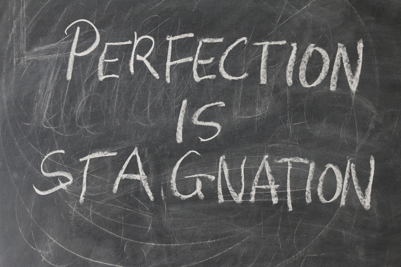 Editorial illustration of perfectionism and procrastination in goal execution